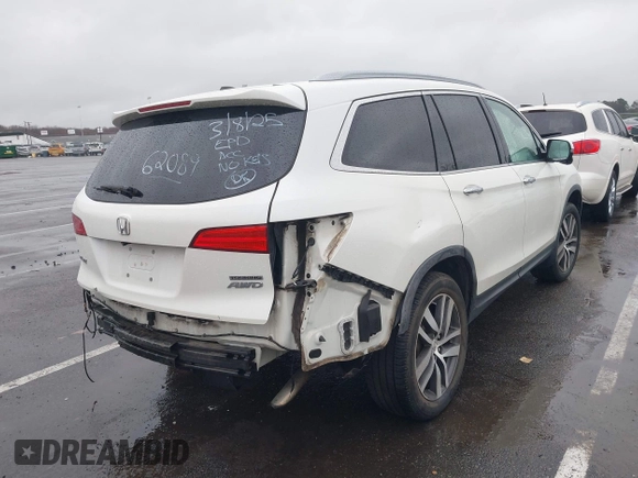 2016 Honda Pilot Touring with VIN 5FNYF6H95GB062089, listed as a IAAI auction lot 41810378 with 74,704 mi miles and . Bid and sale history available at DreamBid. Image 4.