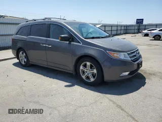 2012 Honda Odyssey Touring с VIN 5FNRL5H9XCB109229, выставлен на аукционе Copart как лот 59885895 с пробегом 153 668 миль миль и Чистый • Clean title. История ставок и продаж доступна на DreamBid. Изображение 4.