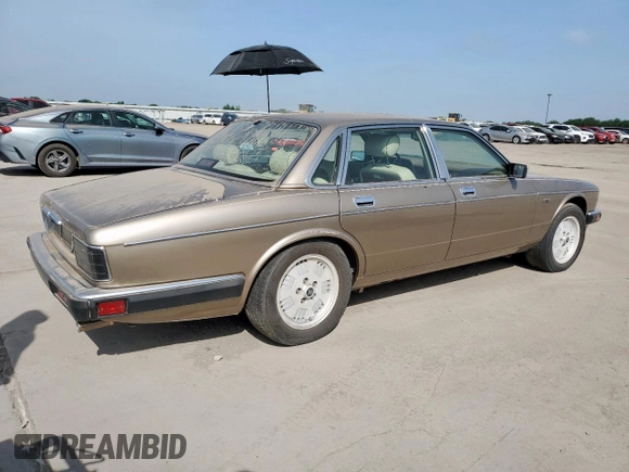 1994 Jaguar XJ с VIN SAJKX174XRC692378, выставлен на аукционе Copart как лот 65275795 с пробегом 80 748 миль миль и Чистый • Clean title. История ставок и продаж доступна на DreamBid. Изображение 3.