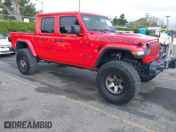 2021 Jeep Gladiator Rubicon with VIN 1C6JJTBGXML572976, listed as a IAAI auction lot 42134909 with 35,612 mi miles and . Bid and sale history available at DreamBid. Image 1.