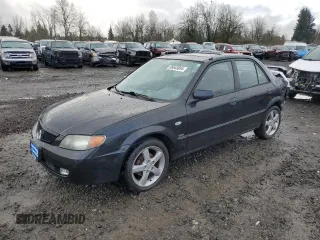 2003 Mazda Protege DX with VIN JM1BJ225331210519, listed as a Copart auction lot 86648884 with 84,258 mi miles and Salvage Title. Bid and sale history available at DreamBid. Image 1.