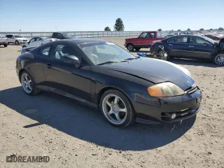 2004 Hyundai Tiburon GT with VIN KMHHN65F94U113699, listed as a Copart auction lot 53858355 with 221,999 mi miles and Salvage Title. Bid and sale history available at carsss.com. Image 4.