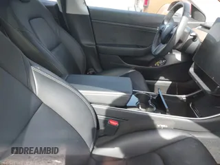 2020 Tesla Model 3 Standard Range Plus with VIN 5YJ3E1EA9LF708808, listed as a IAAI auction lot 40018323 with 32,069 mi miles. Bid and sale history available at carsss.com. Image 5.