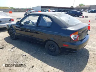 2003 Hyundai Accent with VIN KMHCF35CX3U271513, listed as a IAAI auction lot 42083235 with 166,240 mi miles. Bid and sale history available at carsss.com. Image 3.