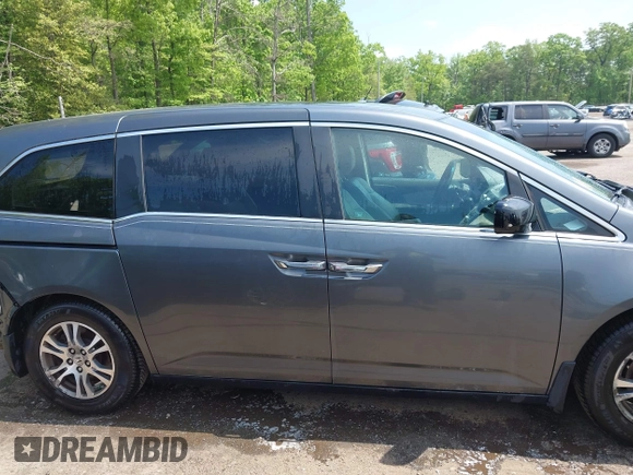 2012 Honda Odyssey EX-L with VIN 5FNRL5H67CB041252, listed as a IAAI auction lot 42158494 with 152,940 mi miles and . Bid and sale history available at DreamBid. Image 14.