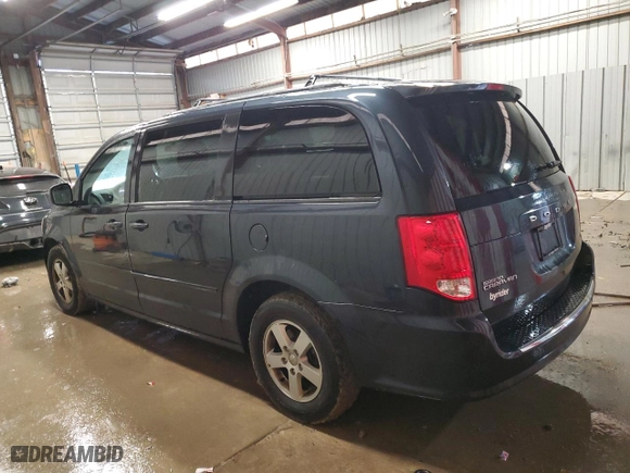 2013 Dodge Grand Caravan SXT with VIN 2C4RDGCG8DR592059, listed as a Copart auction lot 83429054 with 184,866 mi miles and Salvage Title. Bid and sale history available at carsss.com. Image 2.