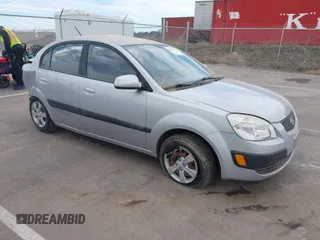 2009 Kia Rio LX with VIN KNADE223496466608, listed as a IAAI auction lot 41889428 with 91,820 mi miles and . Bid and sale history available at DreamBid. Image 1.