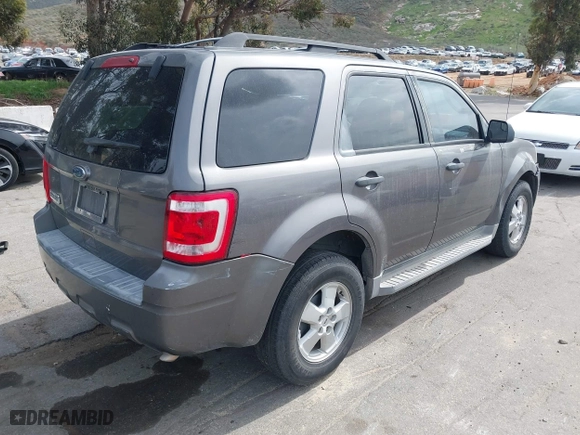 2010 Ford Escape XLT with VIN 1FMCU0D73AKC67711, listed as a IAAI auction lot 41891915 with 254,378 mi miles. Bid and sale history available at carsss.com. Image 4.