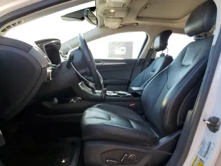 2013 Ford Fusion Titanium Hybrid z VIN 3FA6P0RUXDR376633, wystawiony jako Copart lot #57685555 z przebiegiem 133 248 mil mil oraz Szkoda całkowita • Salvage title. Historia ofert i sprzedaży dostępna na DreamBid. Obrazek 7.