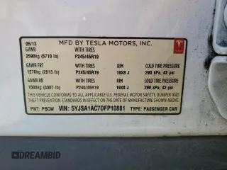 2013 Tesla Model S with VIN 5YJSA1AC7DFP10881, listed as a Copart auction lot 61485235 with 107,032 mi miles and Salvage title. Bid and sale history available at DreamBid. Image 13.