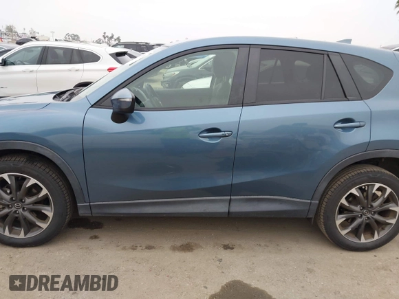 2016 Mazda CX-5 Grand Touring with VIN JM3KE2DY7G0875678, listed as a IAAI auction lot 42104888 with 30,566 mi miles. Bid and sale history available at carsss.com. Image 15.