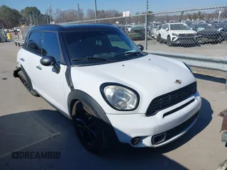2014 MINI Countryman S with VIN WMWZC3C52EWP25060, listed as a IAAI auction lot 41642855 with 240,396 mi miles and . Bid and sale history available at DreamBid. Image 1.