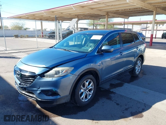 2014 Mazda CX-9 Sport with VIN JM3TB3BA5E0427753, listed as a IAAI auction lot 41679267 with 135,993 mi miles and . Bid and sale history available at DreamBid. Image 2.