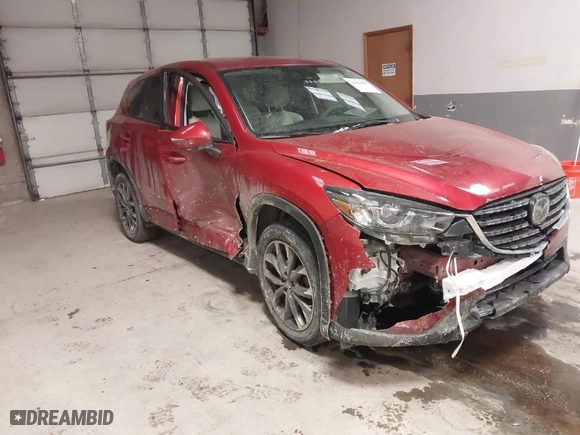 2016 Mazda CX-5 Grand Touring with VIN JM3KE4DY8G0622347, listed as a IAAI auction lot 41618997 with NaN miles. Bid and sale history available at carsss.com. Image 1.