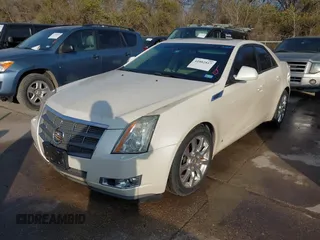 2009 Cadillac CTS AWD z VIN 1G6DT57VX90140080, wystawiony jako IAAI lot #41802817 z przebiegiem 146 978 mil mil oraz . Historia ofert i sprzedaży dostępna na DreamBid. Obrazek 2.