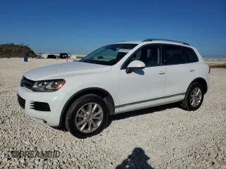 2014 Volkswagen Touareg Sport with VIN WVGEF9BP9ED006863, listed as a Copart auction lot 86834554 with 144,181 mi miles and Clean Title. Bid and sale history available at DreamBid. Image 1.