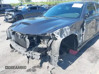 2019 Dodge Charger R/T z VIN 2C3CDXCT7KH527732, wystawiony jako IAAI lot #42283453 z przebiegiem 99 755 mil mil oraz . Historia ofert i sprzedaży dostępna na DreamBid. Obrazek 6.