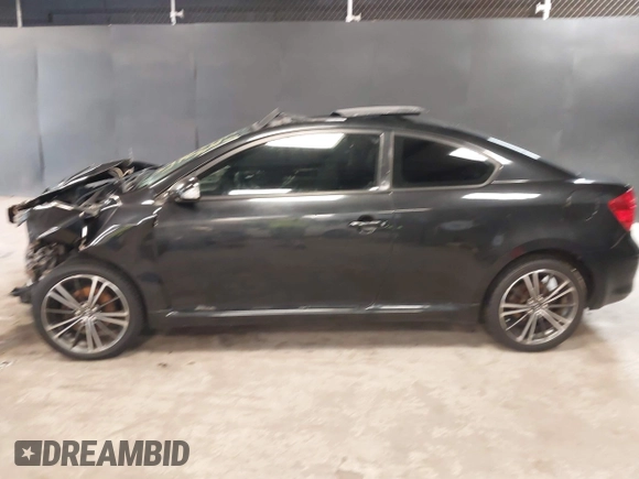 2010 Scion tC with VIN JTKDE3B77A0320585, listed as a IAAI auction lot 39883404 with 140,409 mi miles. Bid and sale history available at carsss.com. Image 15.