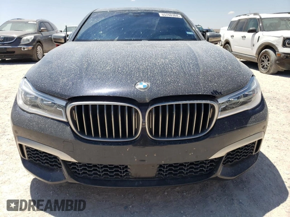 2018 BMW 7 Series M760i xDrive with VIN WBA7H6C51JG614580, listed as a Copart auction lot 65748304 with 46,801 mi miles and Clean Title. Bid and sale history available at carsss.com. Image 5.
