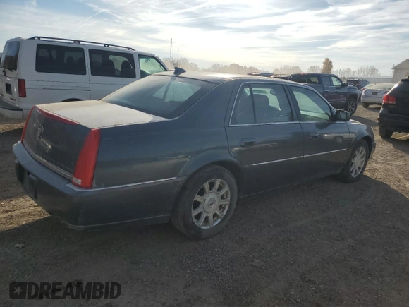2009 Cadillac DTS 1SC z VIN 1G6KD57Y39U129722, wystawiony jako Copart lot #77071164 z przebiegiem 133 769 mil mil oraz Czysty tytuł • Clean title. Historia ofert i sprzedaży dostępna na DreamBid. Obrazek 3.