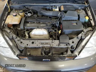 2002 Ford Focus ZX5 z VIN 3FAFP37352R180981, wystawiony jako Copart lot #55856125 z przebiegiem 59 785 mil mil oraz Szkoda całkowita • Salvage title. Historia ofert i sprzedaży dostępna na DreamBid. Obrazek 11.