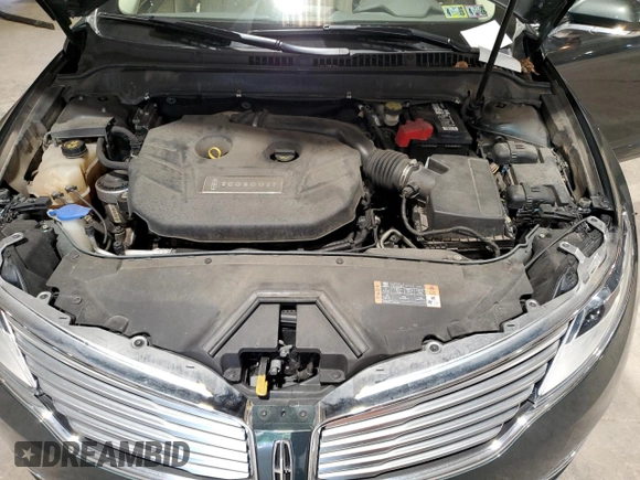 2015 Lincoln MKZ z VIN 3LN6L2J95FR613519, wystawiony jako Copart lot #59165895 z przebiegiem 117 630 mil mil oraz Szkoda całkowita • Salvage title. Historia ofert i sprzedaży dostępna na DreamBid. Obrazek 11.
