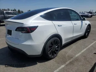 2022 Tesla Model Y Performance with VIN 7SAYGDEFXNF407340, listed as a Copart auction lot 54376895 with 56,709 mi miles and Salvage Title. Bid and sale history available at DreamBid. Image 3.
