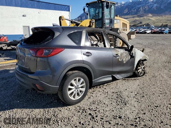 2015 Mazda CX-5 Touring with VIN JM3KE4CYXF0515106, listed as a Copart auction lot 50451185 with 0 mi miles and Salvage Title. Bid and sale history available at carsss.com. Image 3.