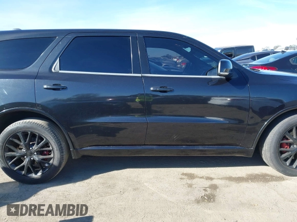 2015 Dodge Durango R/T with VIN 1C4SDHCT5FC937676, listed as a IAAI auction lot 41369508 with 107,075 mi miles and . Bid and sale history available at DreamBid. Image 13.