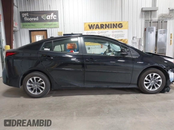 2022 Toyota Prius L Eco with VIN JTDKAMFU2N3186072, listed as a IAAI auction lot 42486252 with 5,887 mi miles and . Bid and sale history available at DreamBid. Image 13.