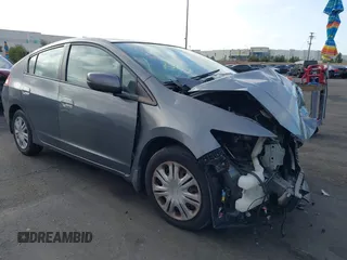 2010 Honda Insight LX z VIN JHMZE2H5XAS038974, wystawiony jako IAAI lot #41958346 z przebiegiem Nie podano mil oraz . Historia ofert i sprzedaży dostępna na DreamBid. Obrazek 1.