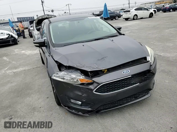 2016 Ford Focus SE z VIN 1FADP3F23GL405565, wystawiony jako Copart lot #60173935 z przebiegiem 82 167 mil mil oraz Szkoda całkowita • Salvage title. Historia ofert i sprzedaży dostępna na DreamBid. Obrazek 13.