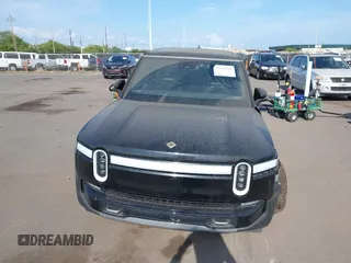 2023 Rivian R1S Adventure z VIN 7PDSGABA8PN020504, wystawiony jako IAAI lot #42025341 z przebiegiem 5989 mil mil oraz . Historia ofert i sprzedaży dostępna na DreamBid. Obrazek 13.