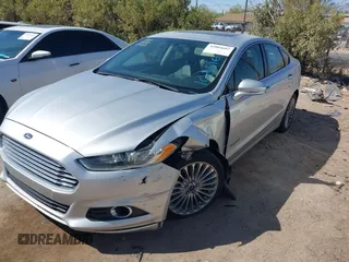2014 Ford Fusion Titanium Hybrid with VIN 3FA6P0RUXER103516, listed as a IAAI auction lot 42004602 with 128,287 mi miles and . Bid and sale history available at carsss.com. Image 17.