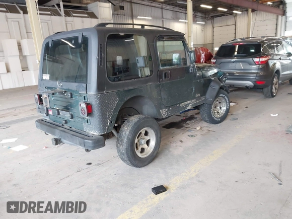2000 Jeep Wrangler Sport with VIN 1J4FA49S8YP780104, listed as a IAAI auction lot 42095731 with Not provided miles and . Bid and sale history available at DreamBid. Image 4.
