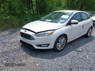2016 Ford Focus Titanium with VIN 1FADP3N26GL332709, listed as a IAAI auction lot 42458997 with 75,509 mi miles and . Bid and sale history available at DreamBid. Image 2.
