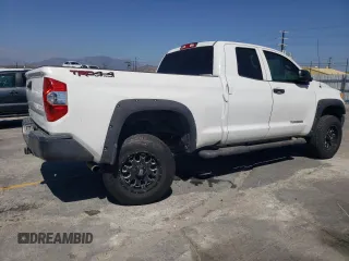 2014 Toyota Tundra SR z VIN 5TFUM5F10EX056473, wystawiony jako Copart lot #56758265 z przebiegiem 129 656 mil mil oraz Szkoda całkowita • Salvage title. Historia ofert i sprzedaży dostępna na DreamBid. Obrazek 3.