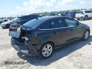 2012 Ford Focus SEL with VIN 1FAHP3H22CL146186, listed as a IAAI auction lot 41977207 with 127,396 mi miles. Bid and sale history available at carsss.com. Image 4.