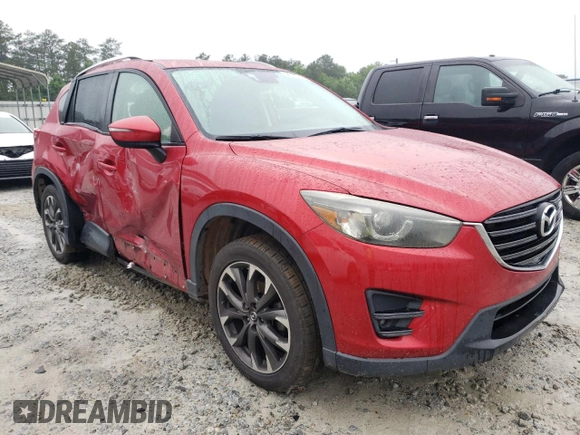 2016 Mazda CX-5 Grand Touring z VIN JM3KE2DY8G0623423, wystawiony jako Copart lot #58599545 z przebiegiem 131 932 mil mil oraz Szkoda całkowita • Salvage title. Historia ofert i sprzedaży dostępna na DreamBid. Obrazek 4.