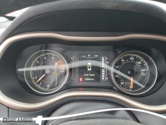 2016 Jeep Cherokee Sport with VIN 1C4PJLAS4GW329112, listed as a Copart auction lot 89201565 with 163,854 mi miles and Salvage Title. Bid and sale history available at carsss.com. Image 9.
