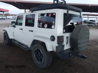 2014 Jeep Wrangler Unlimited Sahara with VIN 1C4BJWEG7EL204489, listed as a IAAI auction lot 41255239 with 68,803 mi miles and . Bid and sale history available at DreamBid. Image 3.