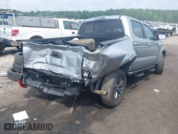2023 Toyota Tacoma SR with VIN 3TYCZ5AN2PT176554, listed as a IAAI auction lot 42148651 with 15,255 mi miles and . Bid and sale history available at DreamBid. Image 4.