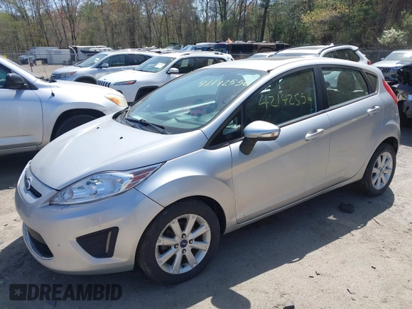2013 Ford Fiesta SE with VIN 3FADP4EJ3DM136332, listed as a IAAI auction lot 42142556 with 69,979 mi miles and . Bid and sale history available at DreamBid. Image 2.