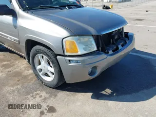 2005 GMC Envoy SLE z VIN 1GKDT13S252331044, wystawiony jako IAAI lot #41749219 z przebiegiem 263 876 mil mil oraz . Historia ofert i sprzedaży dostępna na DreamBid. Obrazek 18.