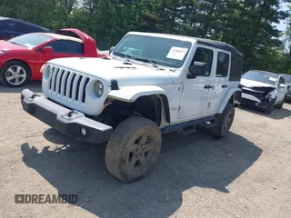 2018 Jeep Wrangler Unlimited Sport S with VIN 1C4HJXDGXJW146873, listed as a IAAI auction lot 42404813 with 73,929 mi miles and . Bid and sale history available at DreamBid. Image 2.
