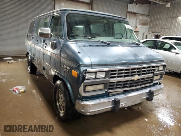 1995 Chevrolet Chevy Van z VIN 1GBEG25K2SF243949, wystawiony jako Copart lot #50422305 z przebiegiem 193 169 mil mil oraz Szkody całkowita. Historia ofert i sprzedaży dostępna na DreamBid. Obrazek 4.