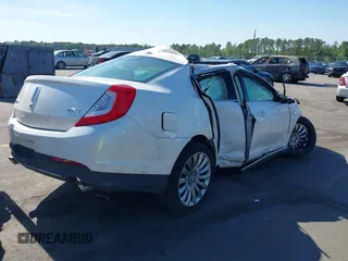 2014 Lincoln MKS with VIN 1LNHL9DK2EG612009, listed as a IAAI auction lot 39278558 with 56,893 mi miles. Bid and sale history available at carsss.com. Image 4.