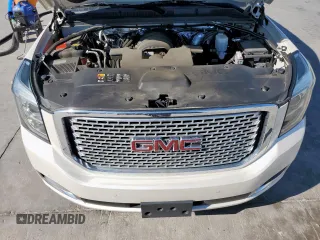 2015 GMC Yukon Denali z VIN 1GKS2CKJ6FR706151, wystawiony jako Copart lot #50556805 z przebiegiem 174 259 mil mil oraz Czysty tytuł • Clean title. Historia ofert i sprzedaży dostępna na DreamBid. Obrazek 14.