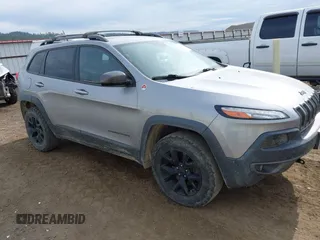 2015 Jeep Cherokee Trailhawk with VIN 1C4PJMBS0FW522182, listed as a IAAI auction lot 42544508 with 74,910 mi miles and . Bid and sale history available at DreamBid. Image 1.