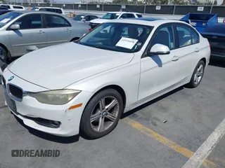 2013 BMW 3 Series 328i with VIN WBA3A5C51DF352812, listed as a IAAI auction lot 41974158 with 176,951 mi miles. Bid and sale history available at carsss.com. Image 2.